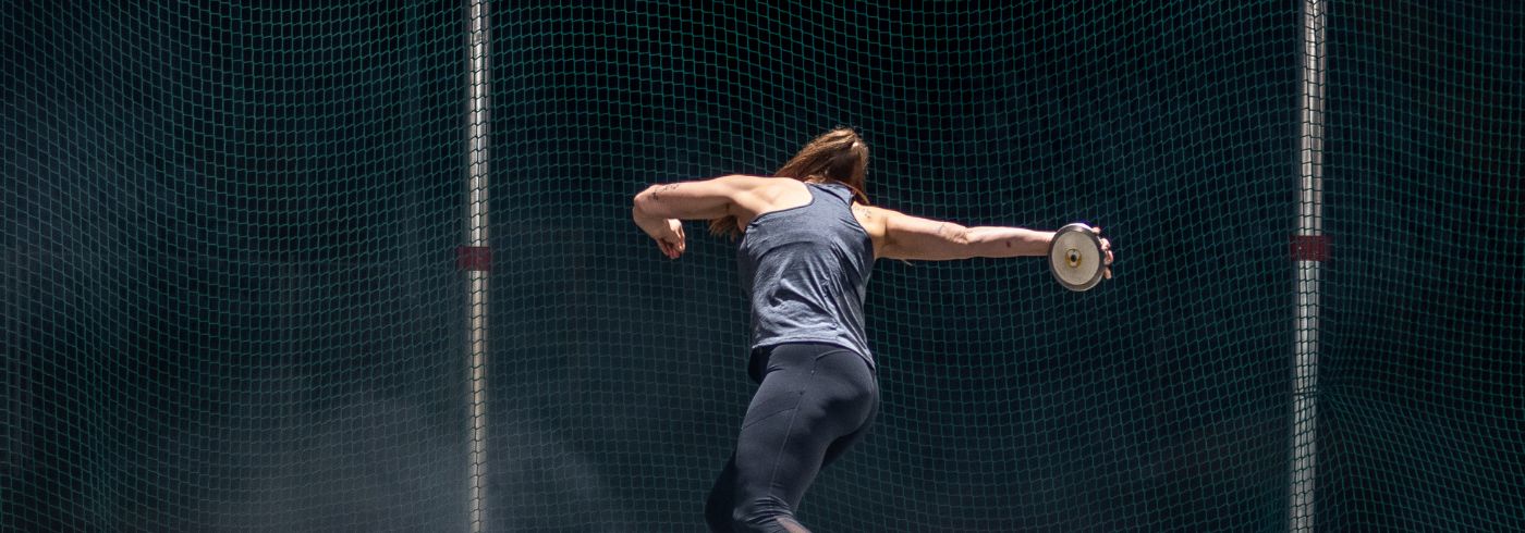 Athlete woman throwing discus